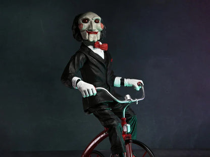 NECA - Saw Billy with riding tricycle (Figura de 12" con sonido)