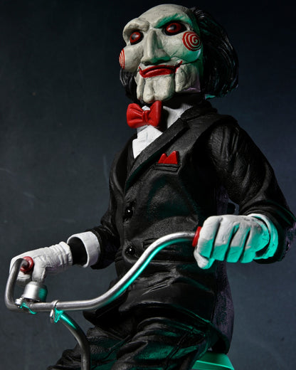 NECA - Saw Billy with riding tricycle (Figura de 12" con sonido)